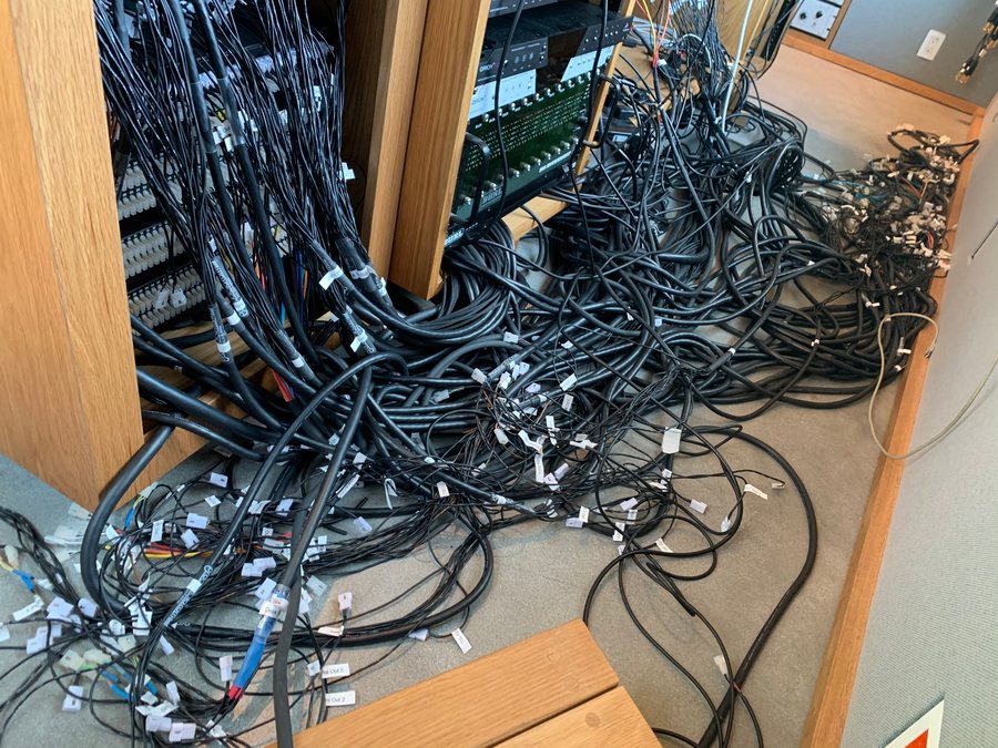 Before: the cable runs behind the patch bay