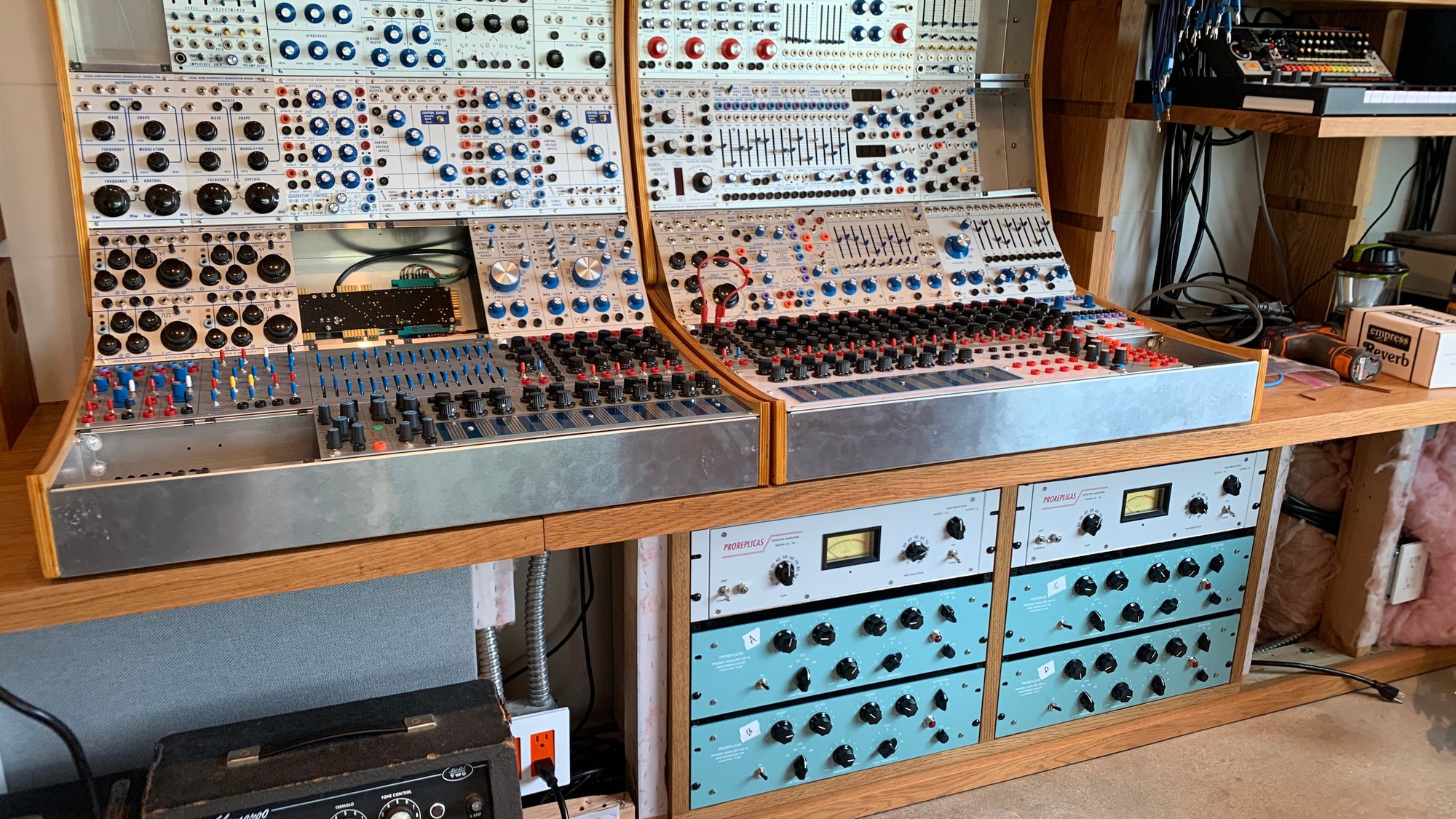 Modular synthesizers above built-in outboard racks in Brad Breeck&rsquo;s studio